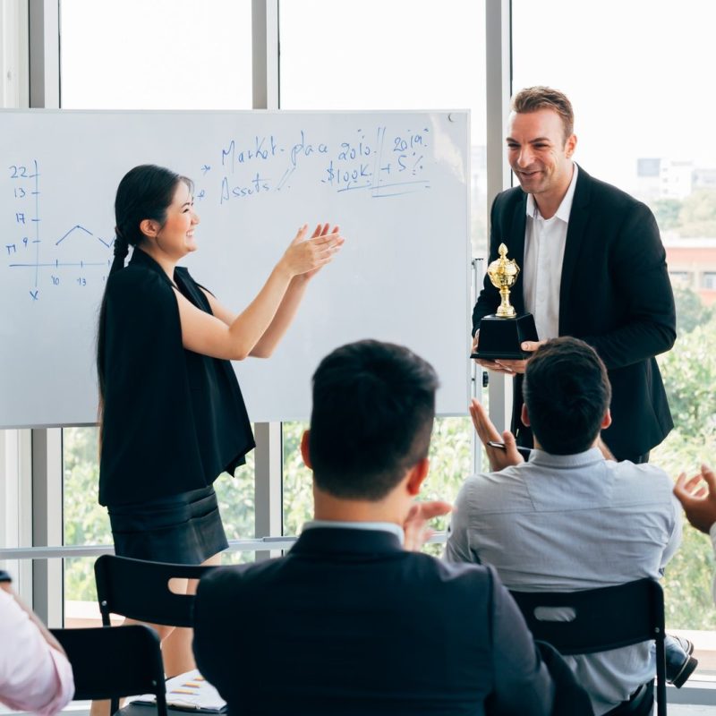 boss-awarding-workers-during-conference.jpg